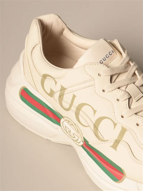 gucci logo sneakers.